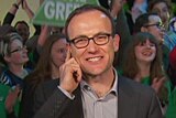Adam Bandt speaks in front of supporters after retaining his seat.