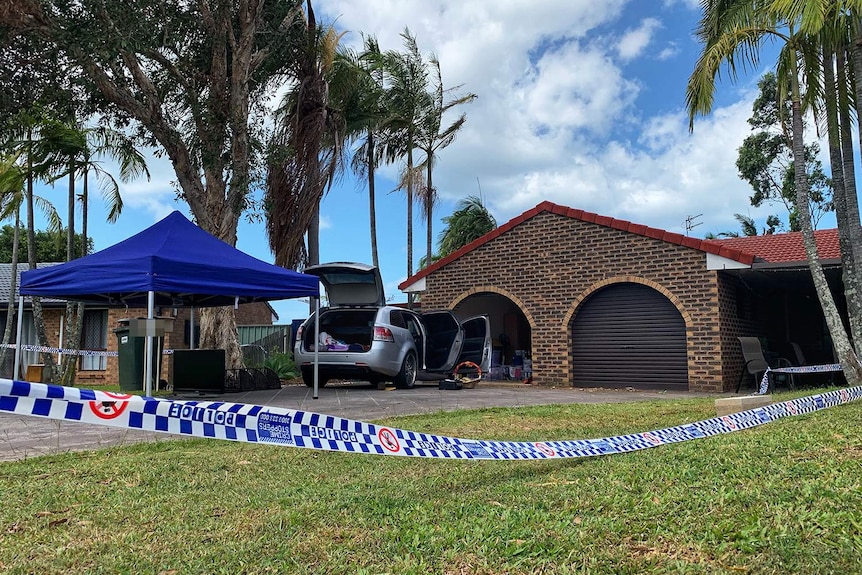 Police tape at crime scene at house at Arundel where a 37-year-old woman was found unconscious in driveway.