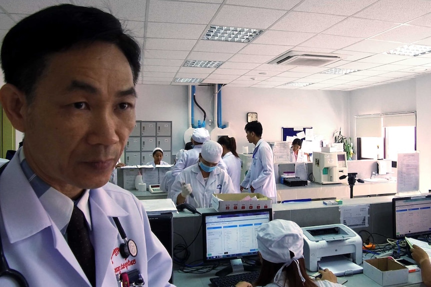Dr Chean Sophal overseeing testing in a lab in Phnom Penh