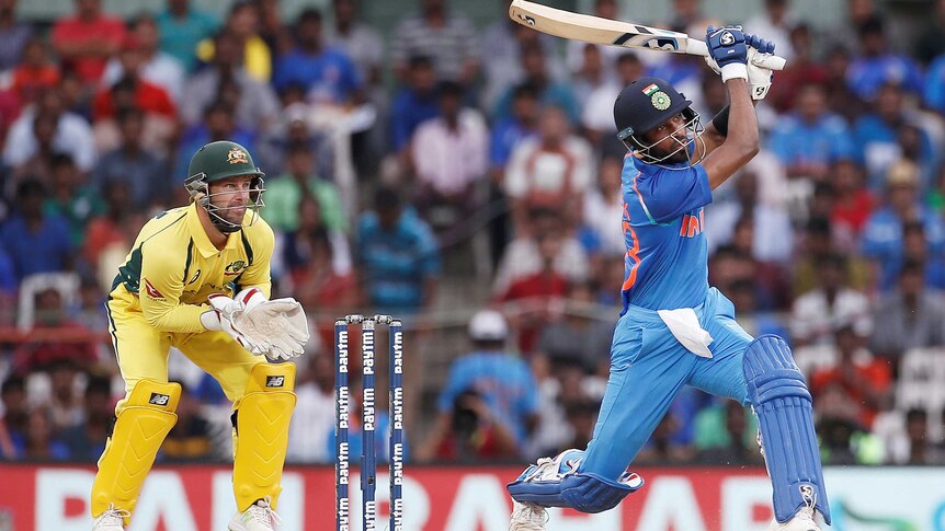 Matthew Wade looks on during as India's Hardik Pandya hits out