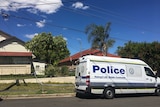 police van out front of house