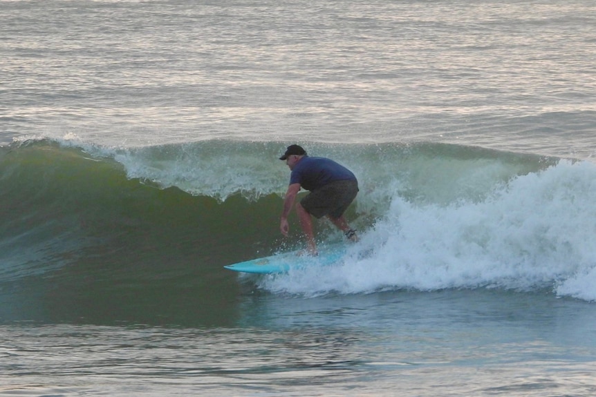 A man surfing on soft barrel wave