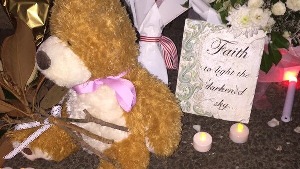 A teddy left at a candlelight vigil for Queenie Xu.