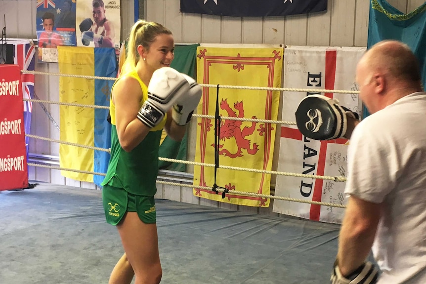 Gold Coast female boxer 22yo Skye Nicolson gloves up during training