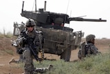 US soldiers pull security around their Stryker MGS