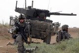 US soldiers pull security around their Stryker MGS