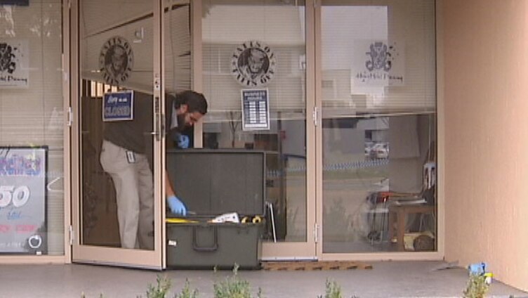 The tattoo parlour staff arrived to find four bullet holes dotted across the front of the store.