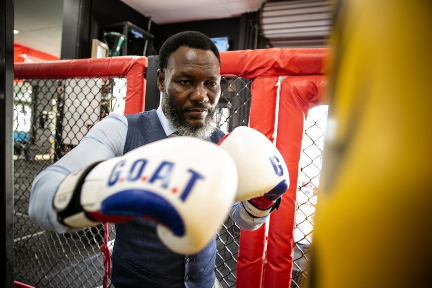 A man with boxing gloves on.