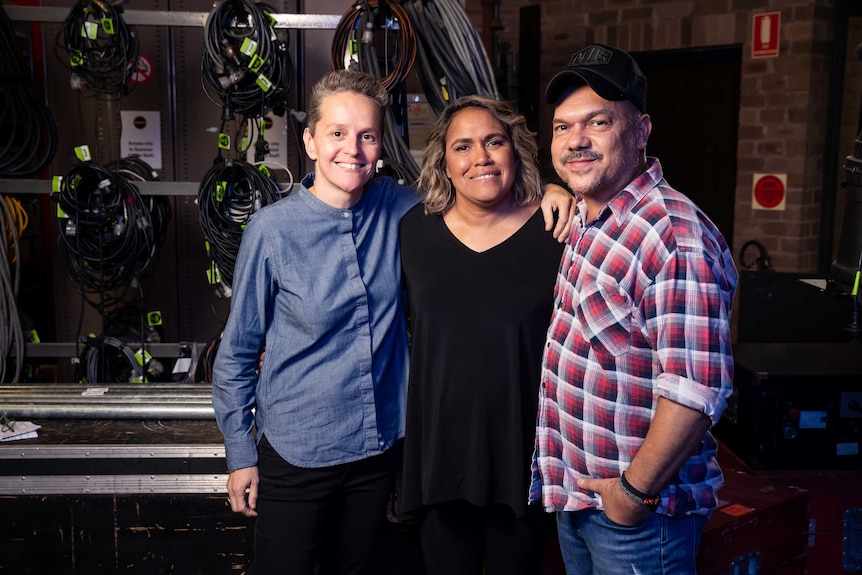 Laurence Billiet, Cathy Freeman, Stephen Page link arms.