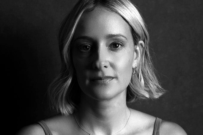 Black and white headshot of a woman