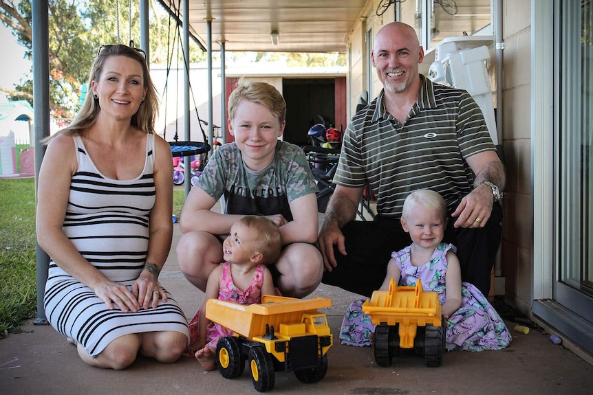 Mt Isa parents Jacque and Bernard Gillic with their three children at their home.
