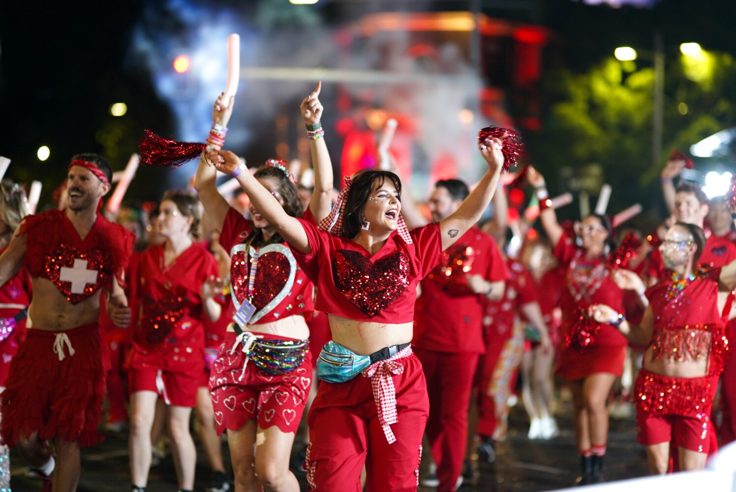 A group of people dressed in red with love hearts