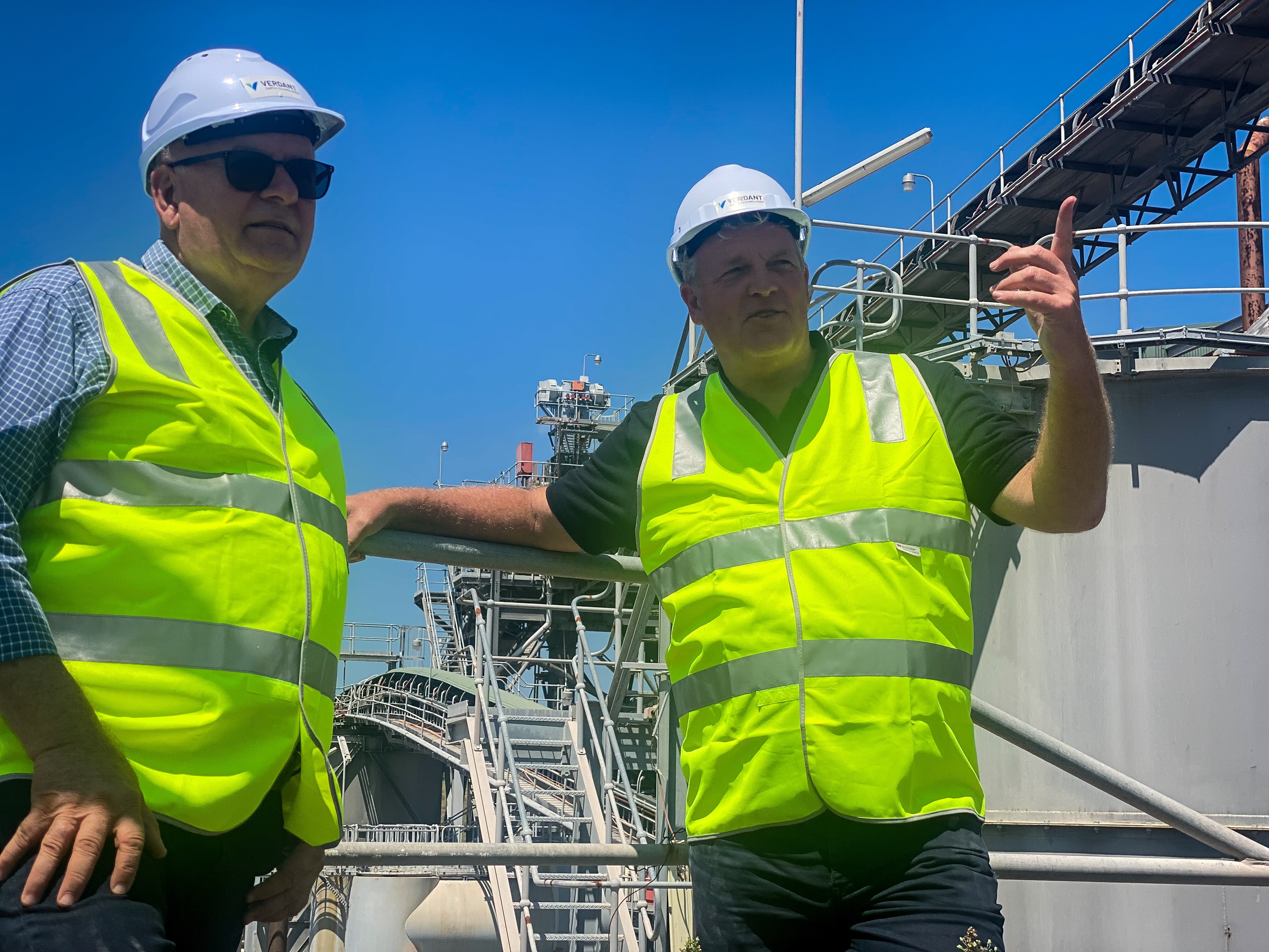 two men in hi-viz in conversation.