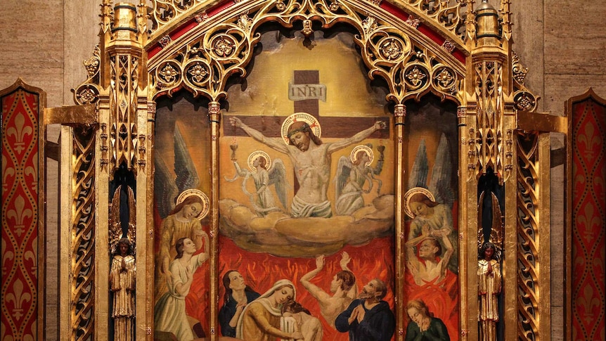 A triptych of Holy Souls in purifying fire of Purgatory in the Dominican church of St Catherine of Siena in New York City.