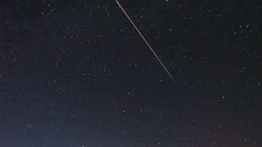 A meteor shoots down towards the horizon during the 2013 Eta Aquariids meteor shower.