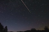 A meteor shoots down towards the horizon during the 2013 Eta Aquariids meteor shower.