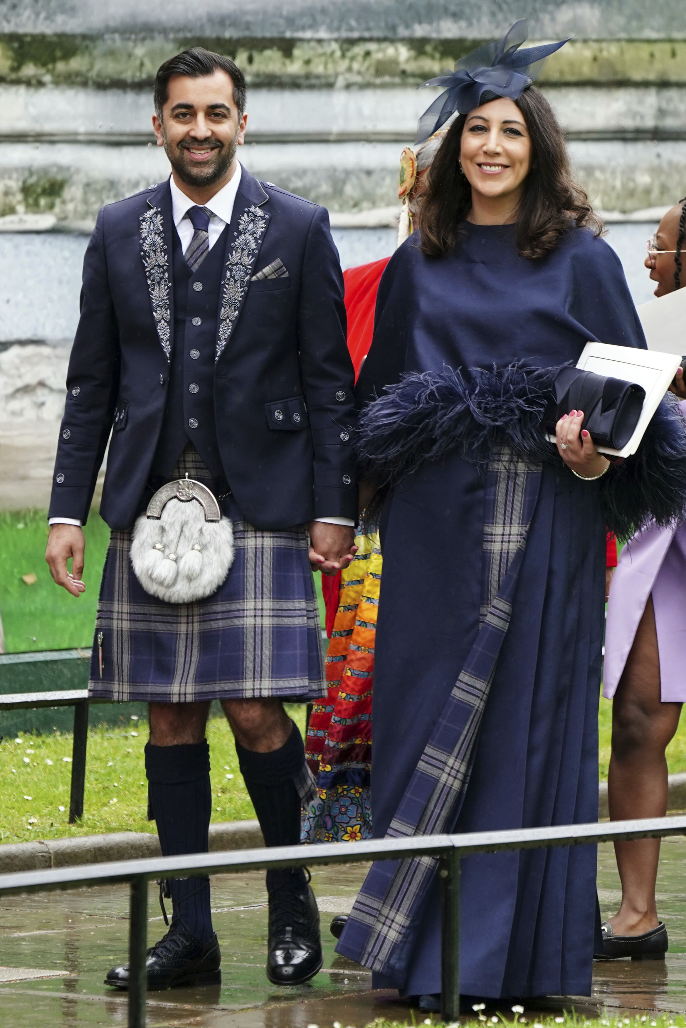 A woman and man both smiling to the camera