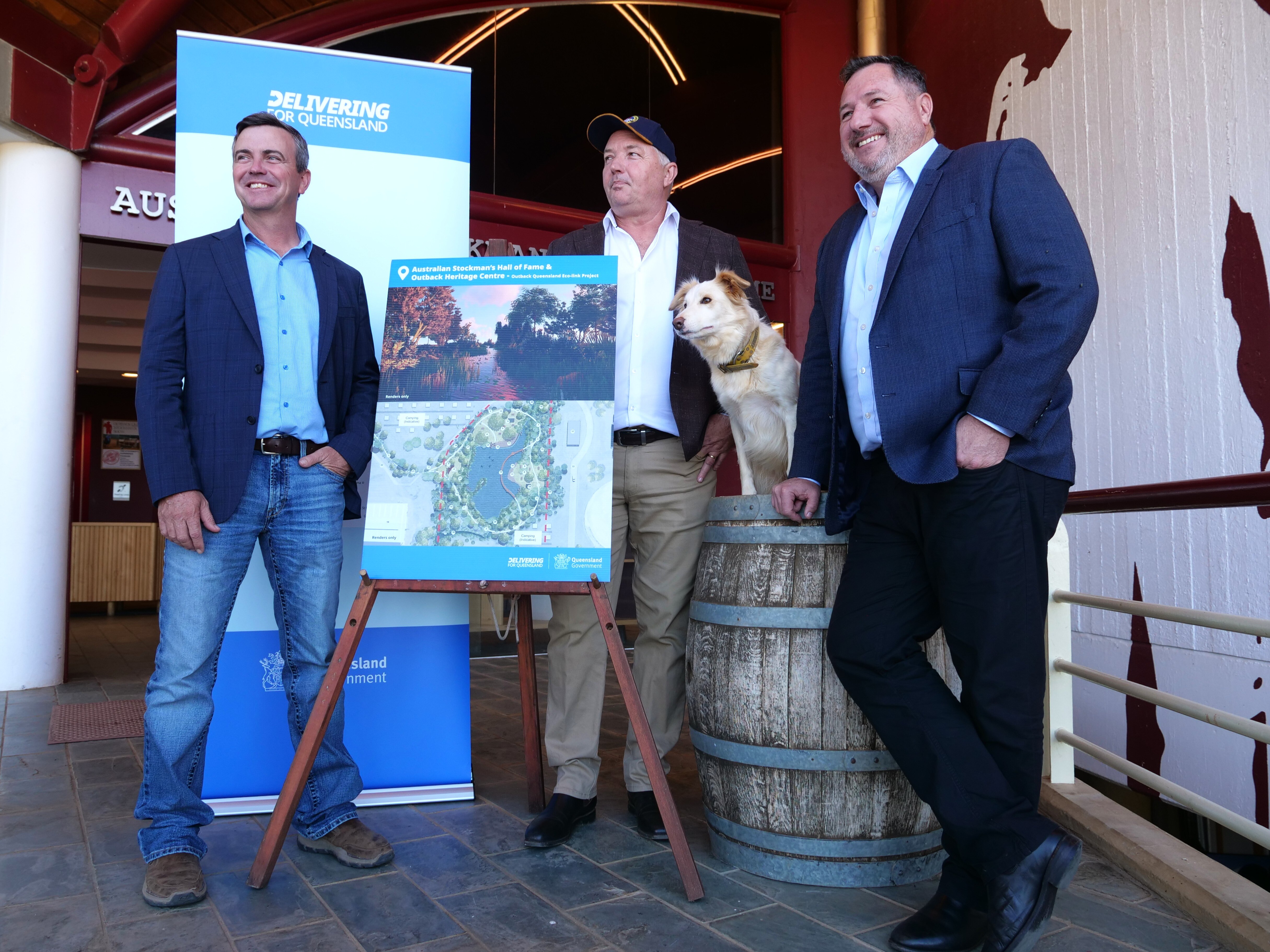Three men standing by a sign for the new mock up plan for the Hall of Fame in Longreach. 