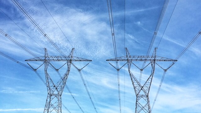 Powerlines in Gippsland in Victoria on a blue sky day.