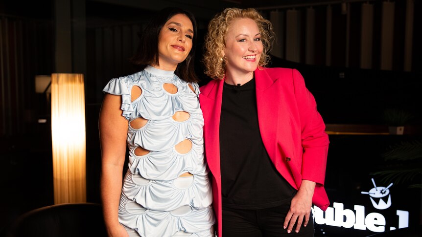 Jessie Ware and Zan Rowe pose for the camera in a sound studio with lamp and Double J logo
