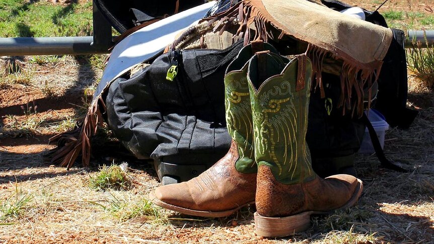 Boots sit beside kit at the Mt Isa Rodeo.