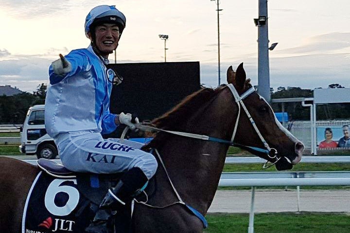 Jockey Manabu Kai on his horse on the racehorse