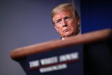 President Donald Trump listens during a briefing about the coronavirus