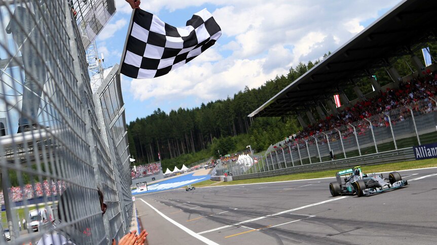Nico Rosberg takes the chequered flag at the Austrian F1 Grand Prix on June 22, 2014.