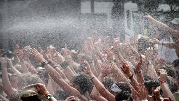 The crowd at the annual Launceston concert music festival, MS Fest, is sprayed with water.