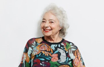 The artist Mirka Mora in a dress made by Gorman with her artwork as a print