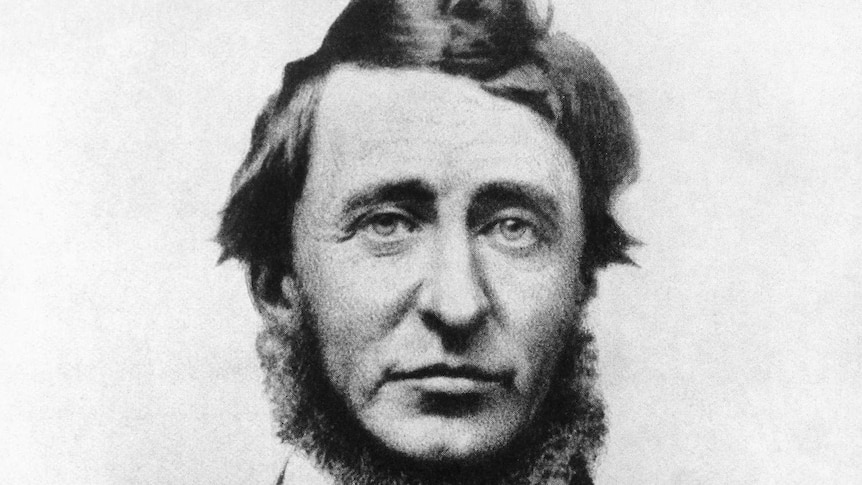 An old black and white photo of Henry David Thoreau, wearing a formal suit