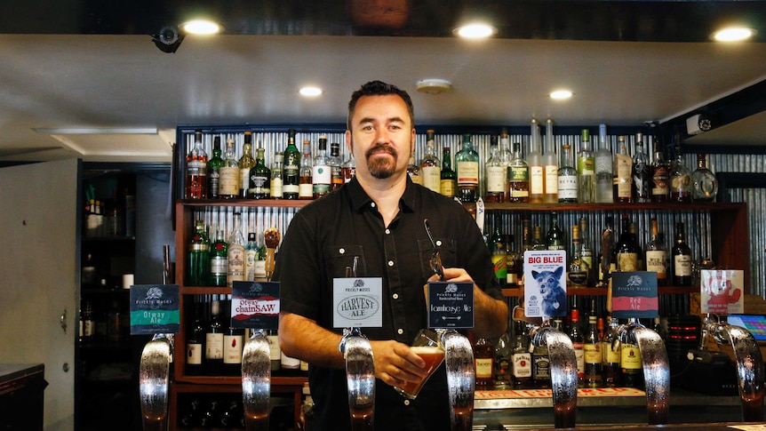 Co-owner Ben Johnston pours a beer at the Old Canberra Inn.