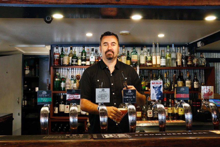 Co-owner Ben Johnston pours a beer at the Old Canberra Inn.
