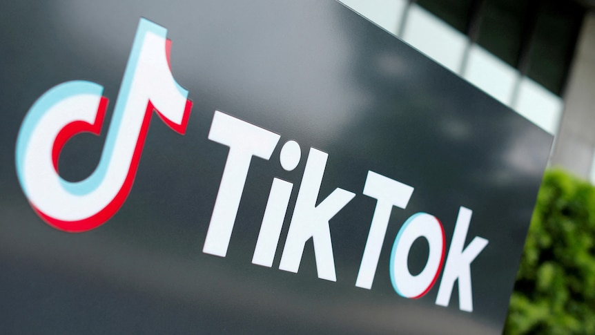 The tiktok logo on a black board