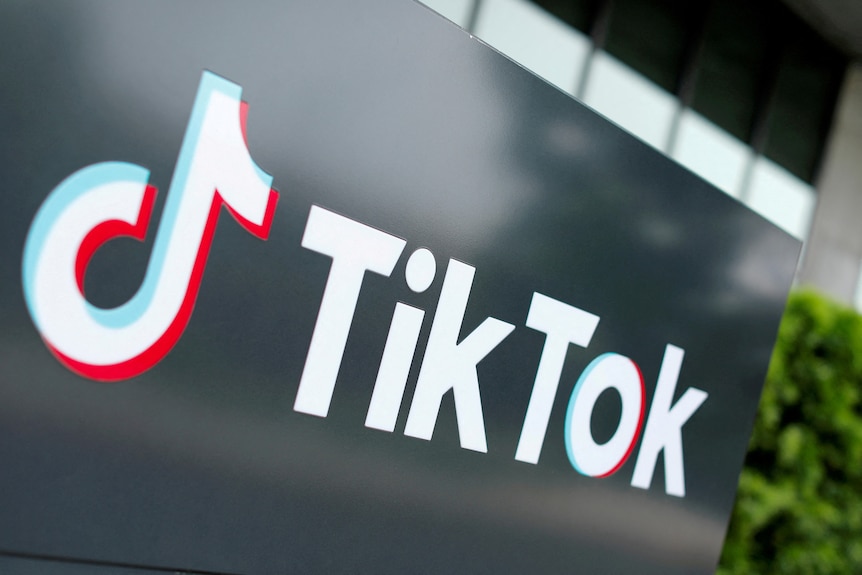 The tiktok logo on a black board