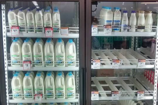 Milk shelf in Echuca showing branded milk is sold out