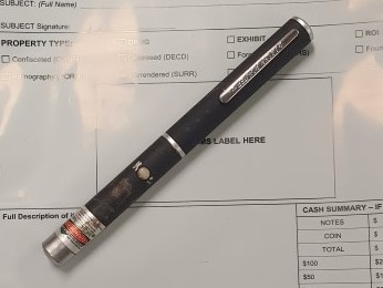 A laser pointer on top of a police form