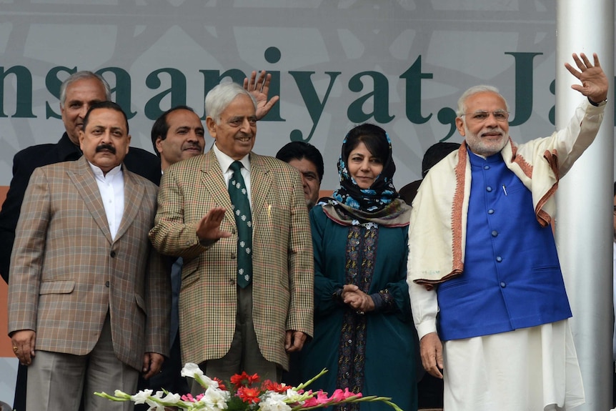 Indian prime minister Narendra Modi greet supporters at a rally.