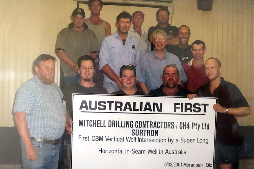A group of men holding a sign saying 'Australian First'.