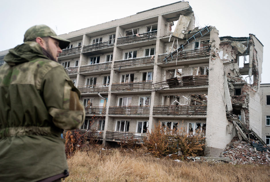 A soldier guards over remnants of an old-age home north of Mariupol, a location continually used by pro-Russian snipers.