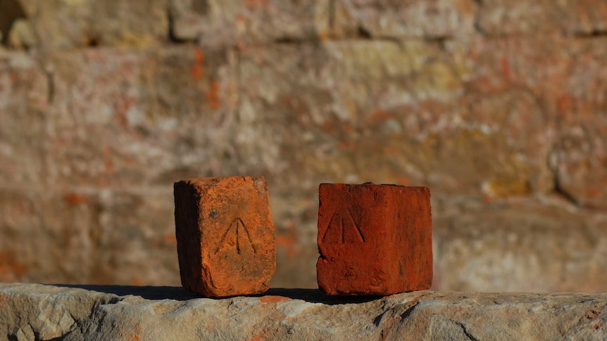 Old bricks with the convict broad arrow stamp