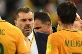 Ange Postecoglou with his Socceroos charges after beating Syria