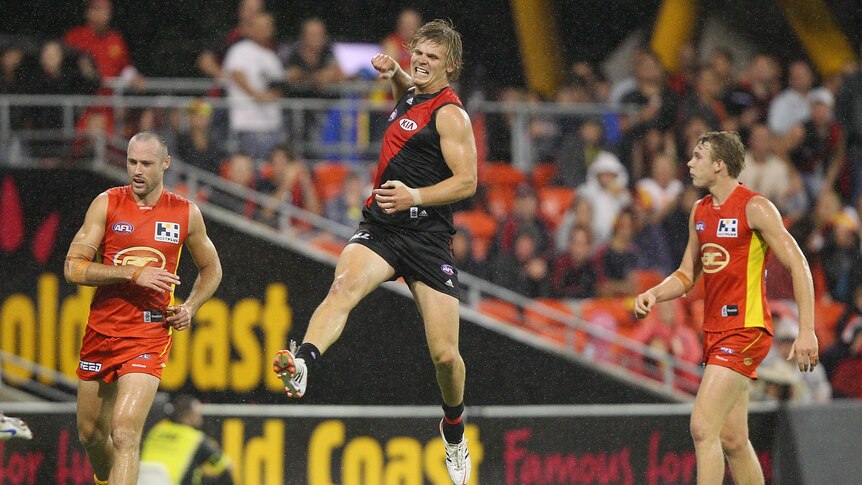 That winning feeling ... Michael Hurley celebrates kicking a goal against the Suns