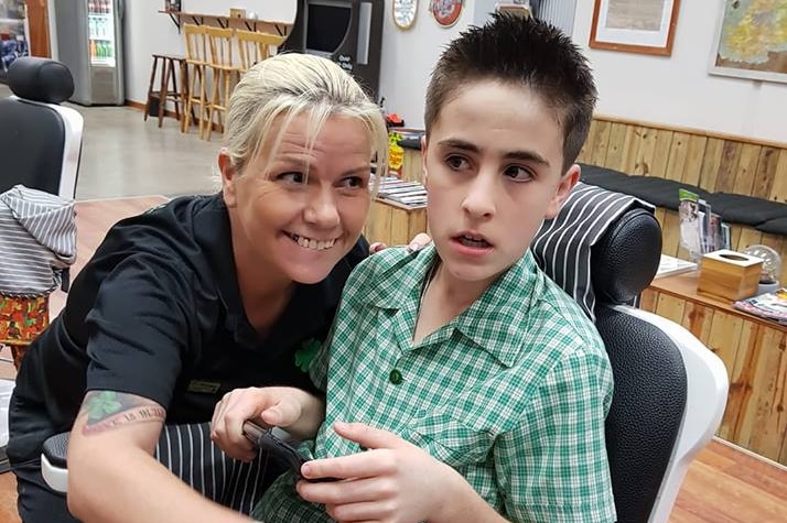 Barber Lisa Ann McKenzie with Jordie after his haircut