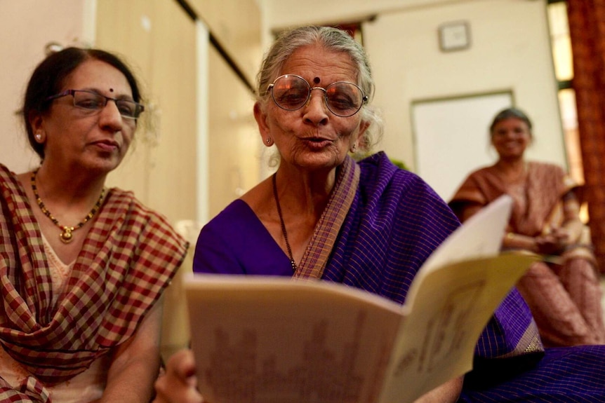 Sailja Joshi reading with fellow student