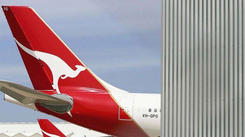 Two Qantas jets sit at Sydney Airport