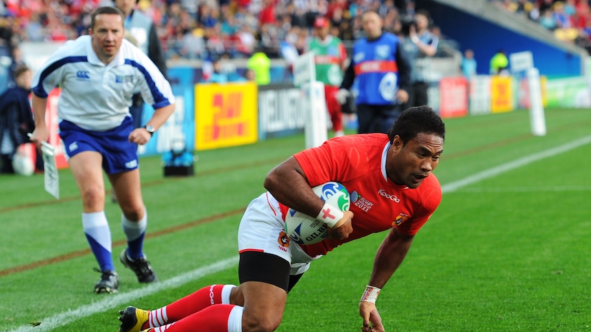 Tonga's Sukanaivalu Hufanga dives over to score the lone try in his side's win over France.