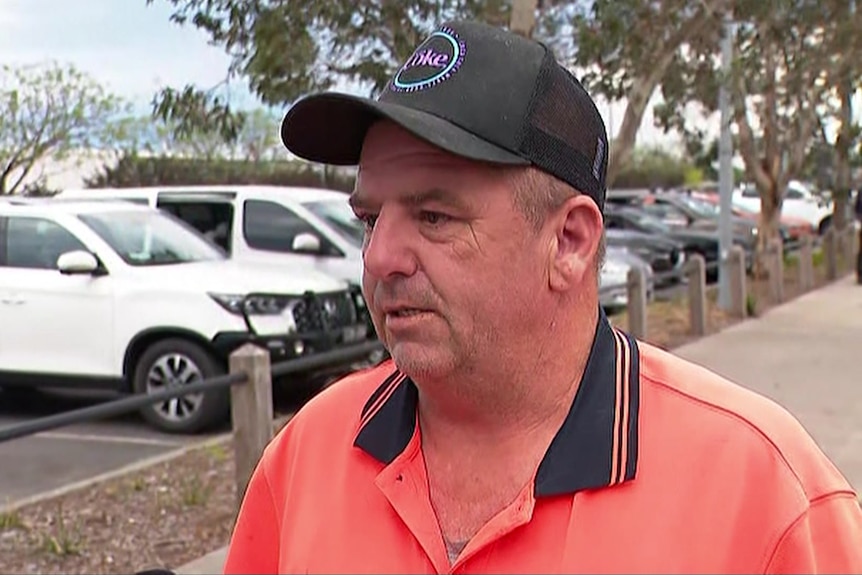 A man in a carpark.