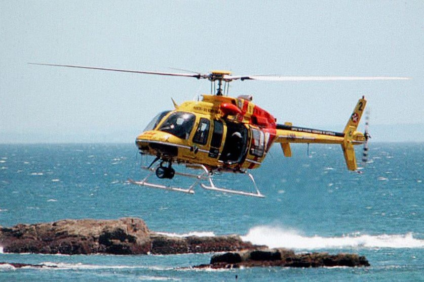 The Hunter's rescue helicopter called to assist after a fishing trawler hit rocks at Harrington on the mid-north coast.