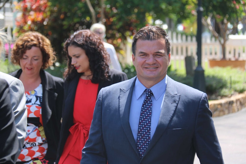 Ken Vowles walks with his NT Labor cabinet colleagues outside Government House in Darwin.